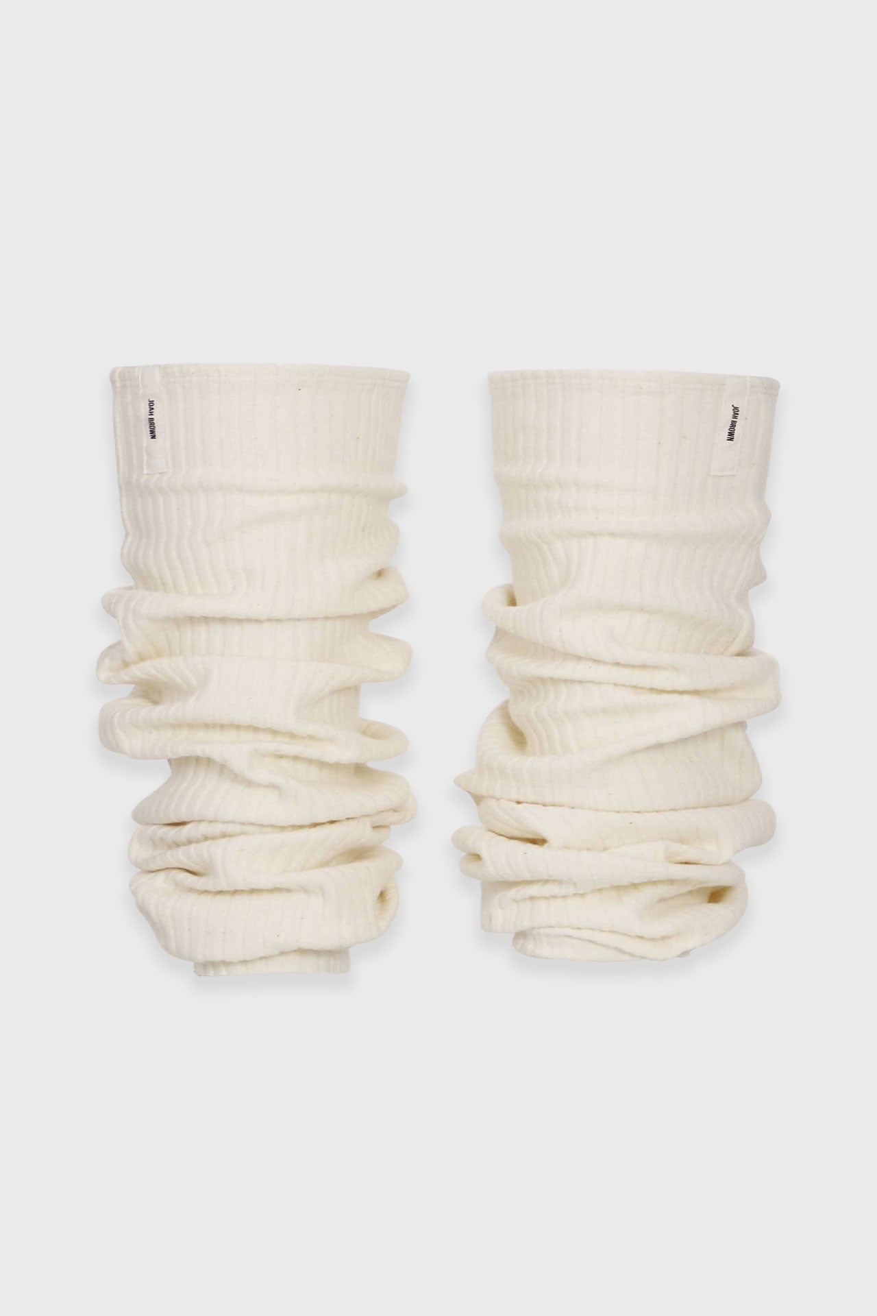 Flat lay front view of the slouchy, pull on natural luxe knit Leg Warmers that can be worn pulled up on scrunched down