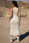 Full body back view of model posing in the sleeveless dune flexrib Plunge Tie Midi Dress with a plunging neckline and tie detail at the bust