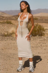 Full body front view of model posing in the sleeveless dune flexrib Plunge Tie Midi Dress with a plunging neckline and tie detail at the bust