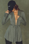 Front view of model posing in the light weight long sleeve ash grey modal Tie Cardigan with adjustable ties at the waist