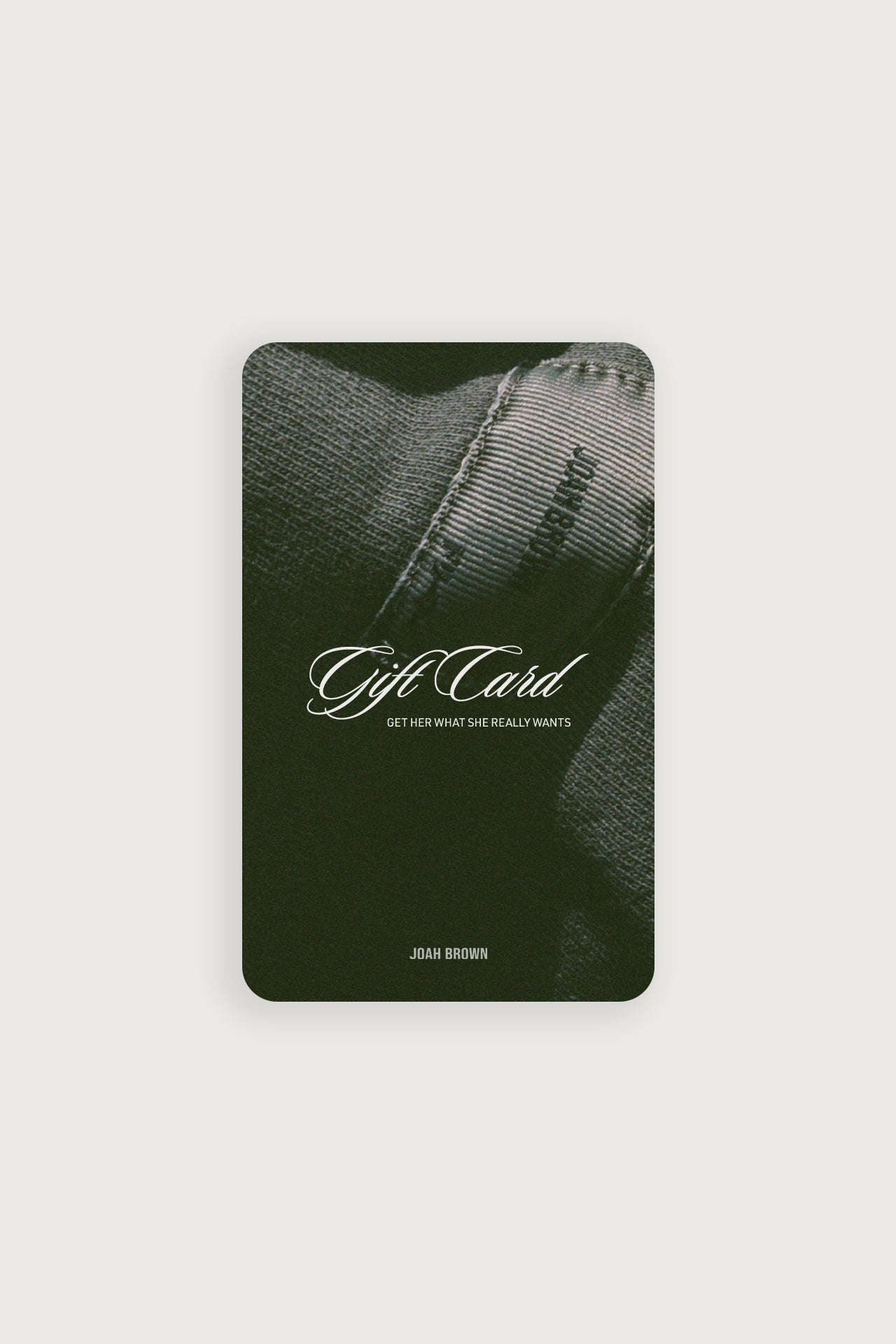Front view of the JOAH BROWN gift card featuring the text: -Gift Card. Get her what she really wants- over a JOAH BROWN cutom patch