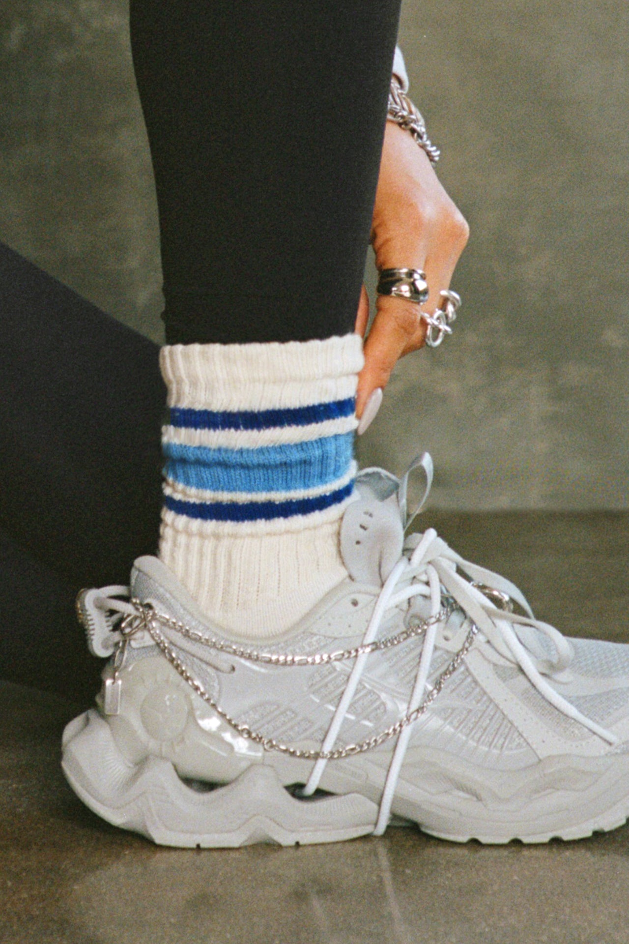 Close up side view of model adjusting the crew style ribbed soft royal sky Classic Stripe Sock