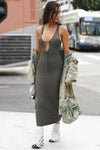 Full body front view of model posing in the sleeveless mineral flexrib Plunge Tie Midi Dress with a plunging neckline and tie detail at the bust