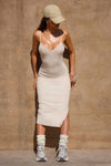 Full body front view of model posing the the midi length dune rib V Neck Dress with a semi-relaxed fit, v neckline, side slit and thin adjustable straps