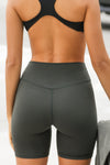 Close up back view of model from the waist down wearing the soft stretchy high-waisted sueded essex Biker Short with a supportive, wide waistband