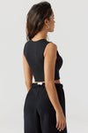 Back view of model posing in the fitted and cropped contouring sueded onyx Second Skin Tank with a high crew neckline