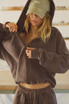 Front view of model posing in the oversized comfortable cedar french terry Oversized Zip Hoodie with a full length front zip closure, side pockets and thumbholes in the fitted cuffs