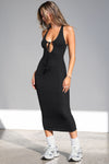 Full body front view of model posing in the sleeveless black flexrib Plunge Tie Midi Dress with a plunging neckline and tie detail at the bust