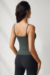 Back view of model posing in the soft and stretchy sueded essex Smoothing Cami with a scoop neckline and thin straps