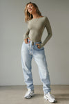 Full body front view of model posing in the fitted, light weight sage modal Boatneck Long Sleeve with a boat neckline