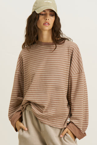Front view of model posing in the relaxed fit, lightweight canyon stripe classic cotton Boxy Crew Long Sleeve top with a crew neckline, dropped shoulders and oversized silhouette