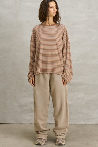 Full body front view of model posing in the relaxed fit, lightweight canyon stripe classic cotton Boxy Crew Long Sleeve top with a crew neckline, dropped shoulders and oversized silhouette