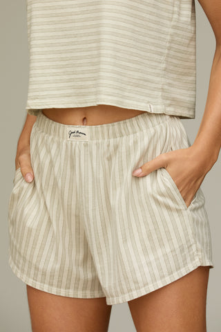 Close up front view of model from the waist down posing in the sage stripe classic cotton boxer-inspired Boxer Short in a relaxed silhouette, with an elastic waistband and side pockets.