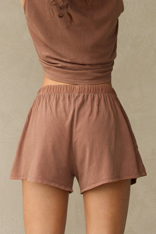 Close up back view of model from the waist down posing in the tobacco classic cotton boxer-inspired Boxer Short in a relaxed silhouette, with an elastic waistband and side pockets.