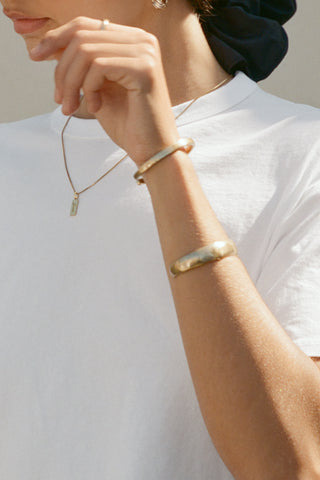 Close up front detail view of model posing in the relaxed fit, lightweight optic white classic cotton Boxy Tee with a crew neckline and short sleeves