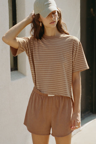 Front view of model posing in the relaxed fit, lightweight canyon stripe classic cotton Boxy Tee with a crew neckline and short sleeves