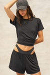 Front view of model posing in the relaxed fit black modal Boyfriend Tee with a crew neckline