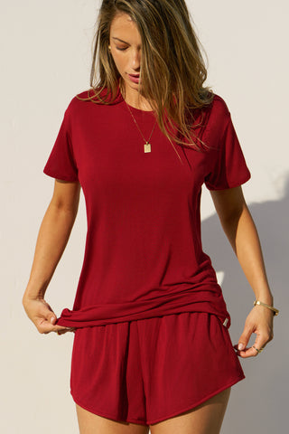Front view of model posing in the relaxed fit cherry modal Boyfriend Tee with a crew neckline