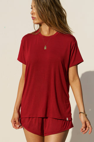 Front view of model posing in the relaxed fit cherry modal Boyfriend Tee with a crew neckline