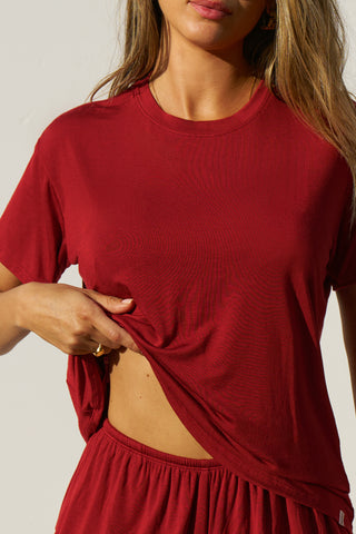 Close up front view of model posing in the relaxed fit cherry modal Boyfriend Tee with a crew neckline