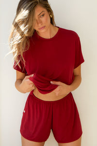 Front view of model posing in the relaxed fit cherry modal Boyfriend Tee with a crew neckline