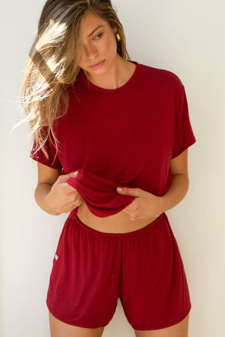 Front view of model posing in the relaxed fit cherry modal Boyfriend Tee with a crew neckline