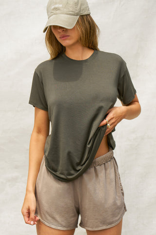 Front view of model posing in the relaxed fit spruce modal Boyfriend Tee with a crew neckline