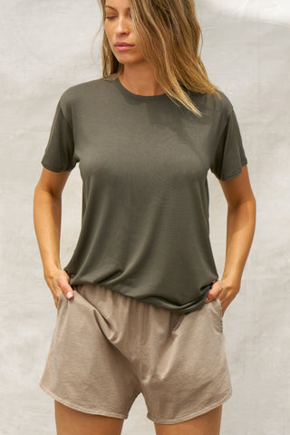 Front view of model posing in the relaxed fit spruce modal Boyfriend Tee with a crew neckline