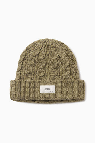 Front flat lay view of the soft and warm oak Cable Knit Beanie that has a custom JOAH BROWN Dreamer logo patch on the front