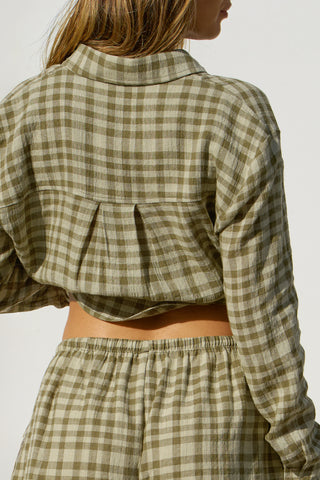 Close up back view of model posing in the lightweight orchard gauze Classic Button Down collared long sleeve shirt with front button closures