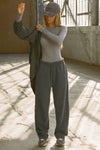 Full body front view of model posing in the fitted and lightweight shadow modal Classic Crew Long Sleeve top with a crew neckline