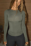 Front view of model posing in the fitted and lightweight spruce modal Classic Crew Long Sleeve top with a crew neckline