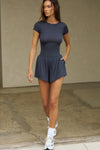 Full body front view of model posing in the lightweight and fitted navy modal Classic Crew Tee shirt with a classic crew neckline and short sleeves.