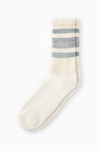 Flat lay view of the crew style ribbed grey/ash classic stripe sock in it's package