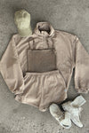 Flat lay view of the sepia washed rib Square Neck Cami, fawn nylon Classic Windbreaker Jacket, fawn nylon Classic Track Short, desert Official Cap and off white Scrunch Sock