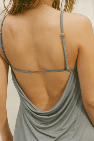 Close up detail back view of model posing in the relaxed fit shadow modal Cowl Back Mini Dress with a v-neckline, thin adjustable straps, A-line silhouette, and an open back with a draped cowl detail