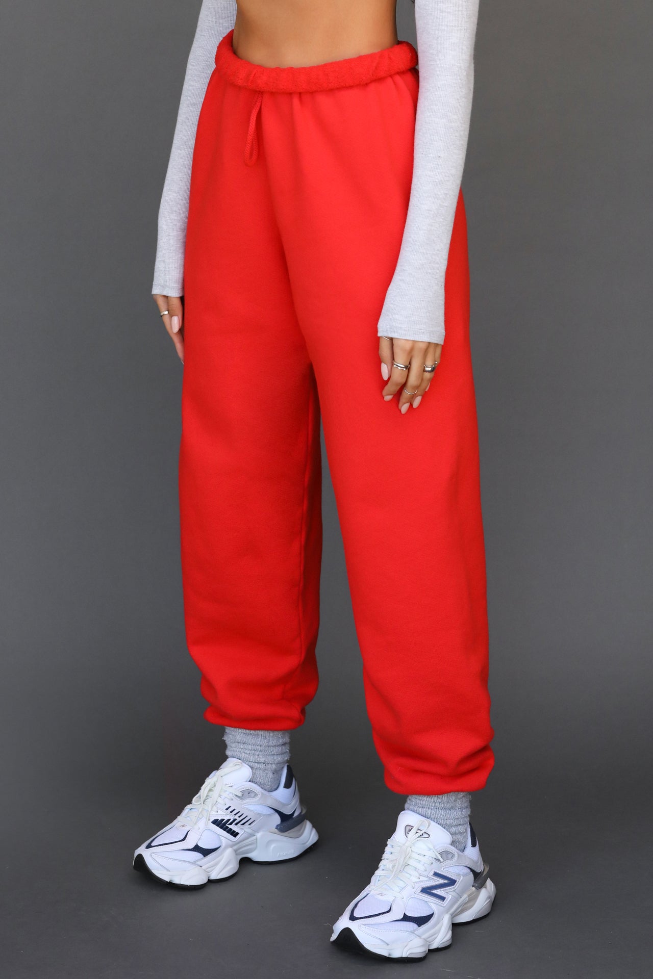 Front view of model from the waist down wearing the oversized loose fit hot sauce french terry Oversized Jogger with an elastic waistband and ankle cuffs