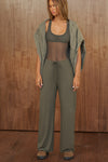 Full body front view of model posing in the relaxed fit spruce modal Relaxed Straight Leg Pant with a wide leg, elastic waistband, adjustable drawstring tie and subtle pleating at the sides.