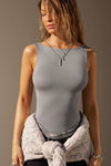 Front view of model posing in the fitted, lightweight shadow modal Boatneck Tank top with a boat neckline