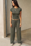 Full body front view of model posing in the lightweight and fitted spruce modal Classic Crew Tee shirt with a classic crew neckline and short sleeves.