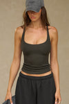 Front view of model posing in the vintage black flexrib Classic Racerback Tank with a scoop neckine and racerback silhouette. 