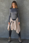 Full body front view of model posing in the fitted and stretchy smoke rib Crewneck Long Sleeve with a banded crew neckline