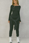 Full body front view of model posing in the fitted, lightweight black modal Boatneck Long Sleeve with a boat neckline