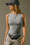 Front view of model posing in the fitted, lightweight shadow modal Boatneck Tank top with a boat neckline