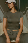 Front view of model posing in the lightweight and fitted spruce modal Classic Crew Tee shirt with a classic crew neckline and short sleeves.