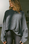 Front view of model posing in the relaxed fit storm sherpa Drop Shoulder Pullover sweatshirt with an exaggerated crew neckline and dropped shoulders.
