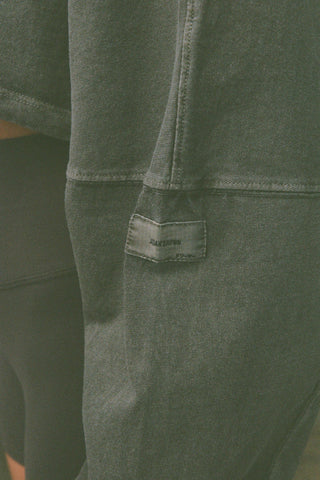 Close up detail view of the sleeve of the  cropped relaxed fit haze cotton Slouchy Crop Long Sleeve top with a crew neckline, dropped shoulders and oversized sleeves