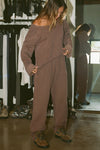 Full body front view of model posing in the oversized cedar french terry Slouchy Pullover Sweatshirt with a wide, off-the-shoulder neckline and a JOAH BROWN logo patch on the right sleeve