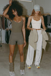 Two models posing in the fitted and slightly cropped woodland and bone flexrib Strappy Scoop Tanks with a scoop neckline and adjustable straps. 