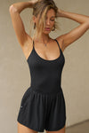 Front view of model posing in the fitted blush modal Scoop Neck Cami with thin adjustable straps, scoop neckline and scoop back